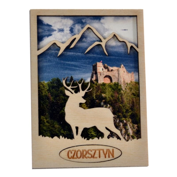drewniany magnes jeleń z ażurowymi górami w tle znajduje się zamek