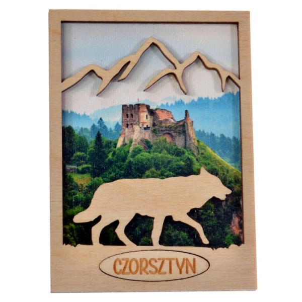 drewniany magnes wilk z konturem gór w tle znajduje się widoczek na którym jest zamek
